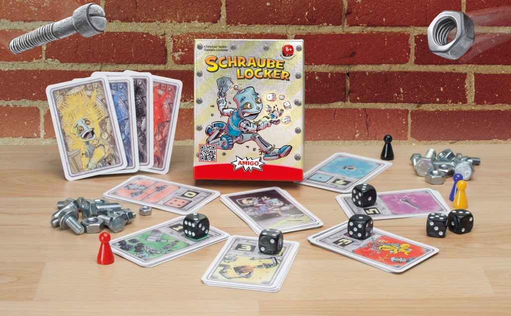 Spielaufbau des Spiels Schraube locker: Karten im Kreis mit Würfel und Pöppel